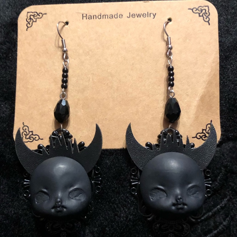 Black devil baby earrings